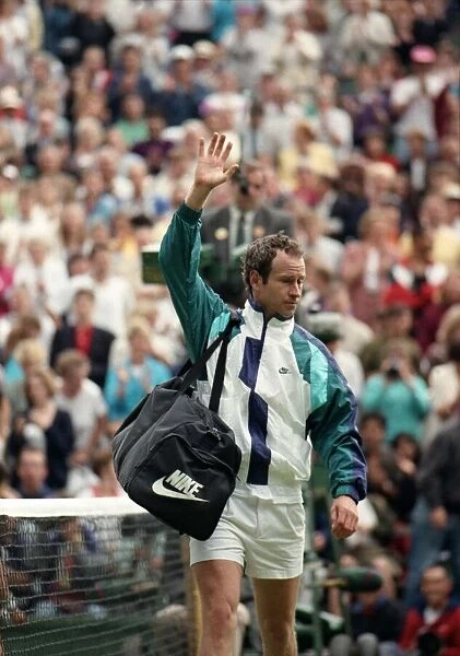 All England Lawn Tennis Championships at Wimbledon. John McEnroe waves to