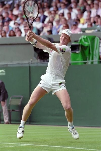 All England Lawn Tennis Championships at Wimbledon. Jim Courier in action during