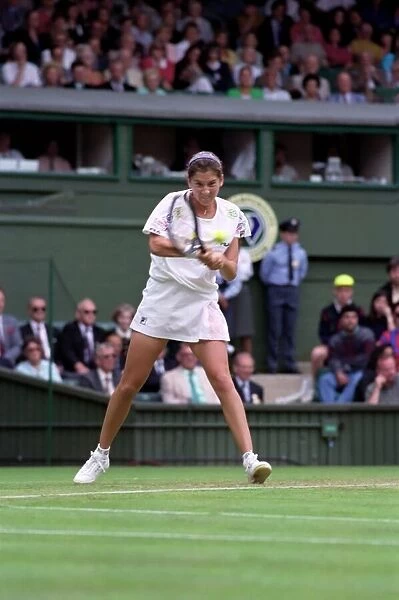 All England Lawn Tennis Championships at Wimbledon. Monica Seles in action during