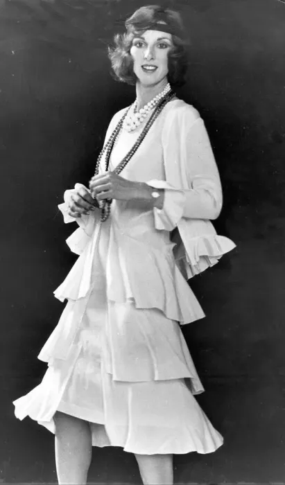 Framed Print : All that jazz... Cream sleeveless dress de chine has triple flared skirt