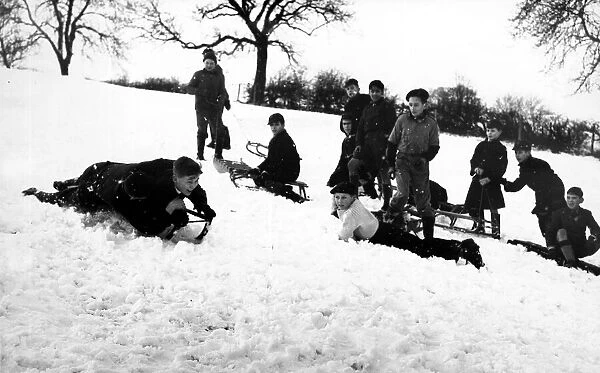 Its all about who can go the fastest as children go sledging in 1960