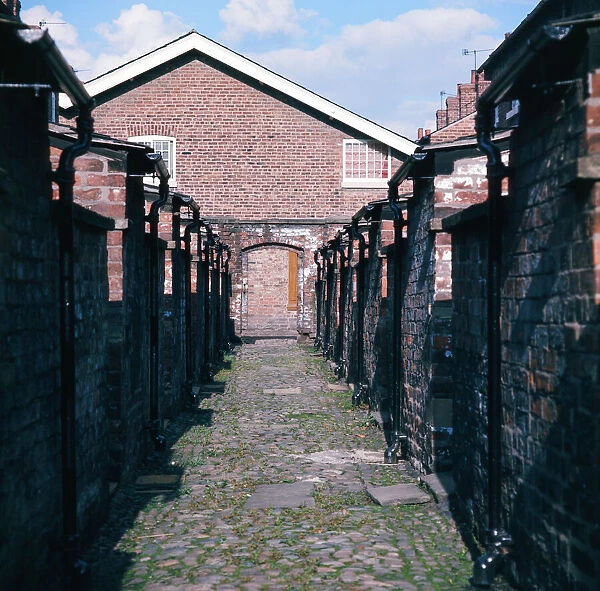 Back alley at cottages at the restored Quarry Bank Mill in Styal, Cheshire, 1973