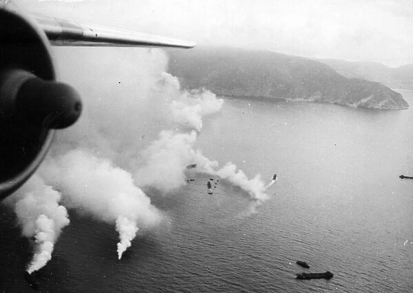 Allied landing craft approaching the Island of Elba behind a smokescreen early in