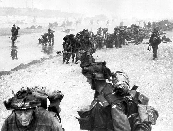 Allied troops land on beach in France during World War Two invasion