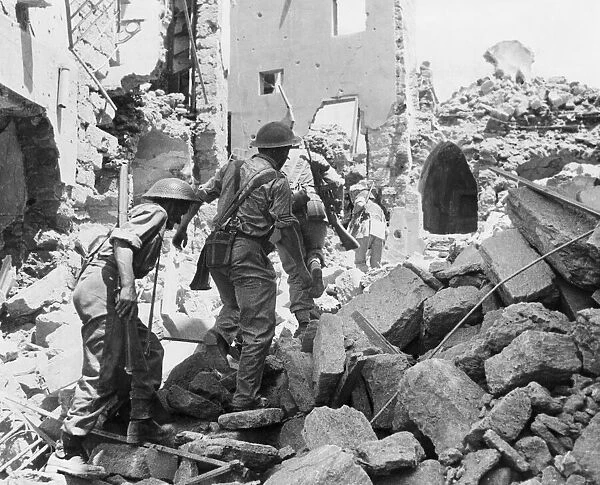 Allied troops in Pantellaria. Troops patrolling the devastated streets in search