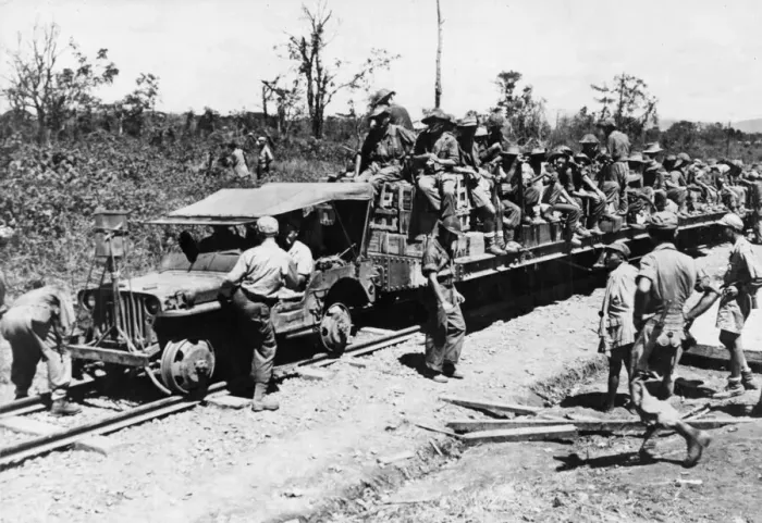 Framed Print : Allied troops use a jeep as a locomotive on the 37 mile railroad which runs from Mougang Framed Print : Allied troops use a jeep as a locomotive on the 37 mile railroad which runs from Mougang