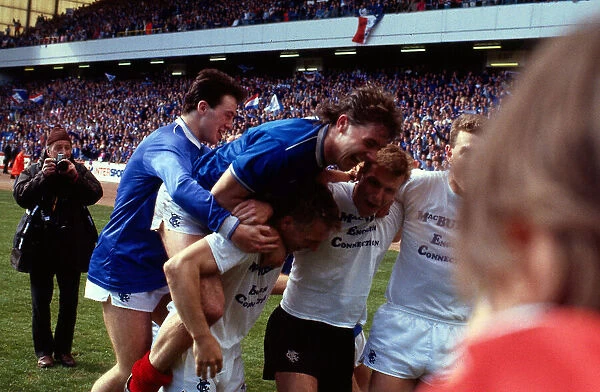 Ally McCoist jumps on Graham Roberts back May 1987