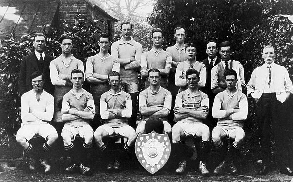 Alvechurch football club team group with Redditch Cup and Shield in 1924 outside the Red