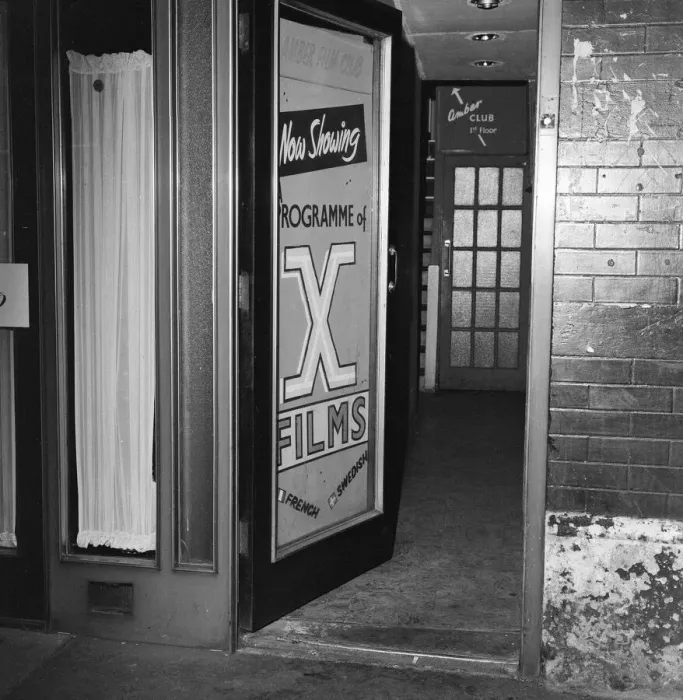 Framed Print : The Amber Film Club on Frith Street in Soho, London, showcasing X Rated adult french