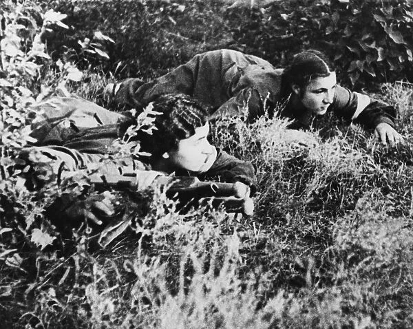 Two ambulance crew of the Red Army move up with a stretcher on the Soviet front line