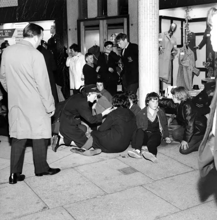 Framed Print : Ambulance men and medical workers attend to Beatles fans who were injured in a crush as Framed Print : Ambulance men and medical workers attend to Beatles fans who were injured in a crush as