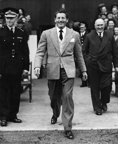 American actor and comedian Danny Kaye walks out onto the pitch at Hampden Park prior to