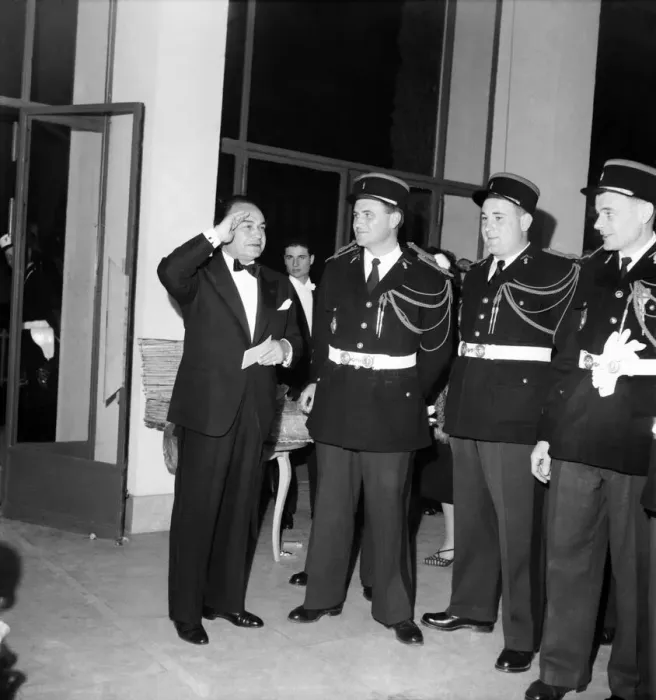 Framed Print : American Actor Edward G Robinson seen here saluting French Policeman. D3118-022