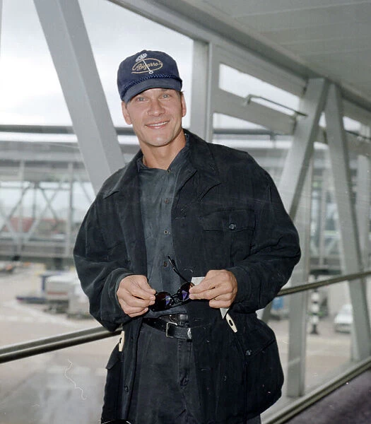 American actor Patrick Swayze on arrival at Heathrow Airport from Los Angeles