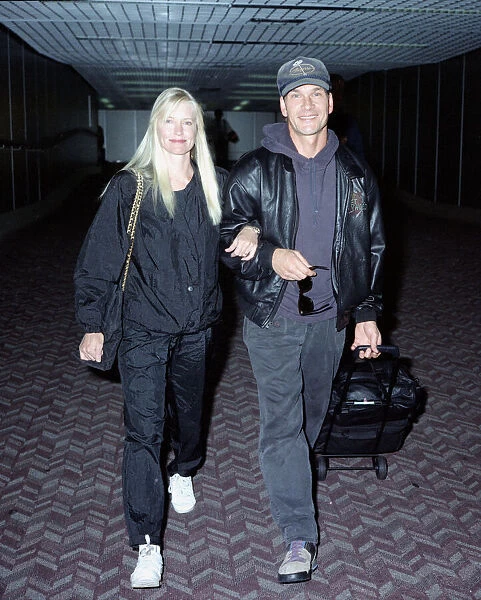 American actor Patrick Swayze with his wife Lisa on arrival at Heathrow Airport