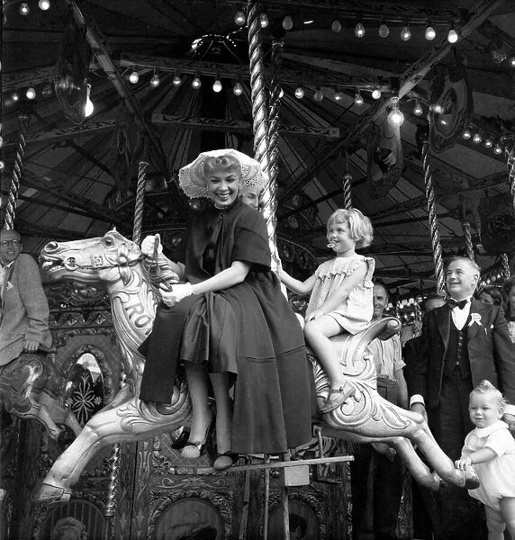 American actress Dolores Gray at Plymouth, riding on the carousel