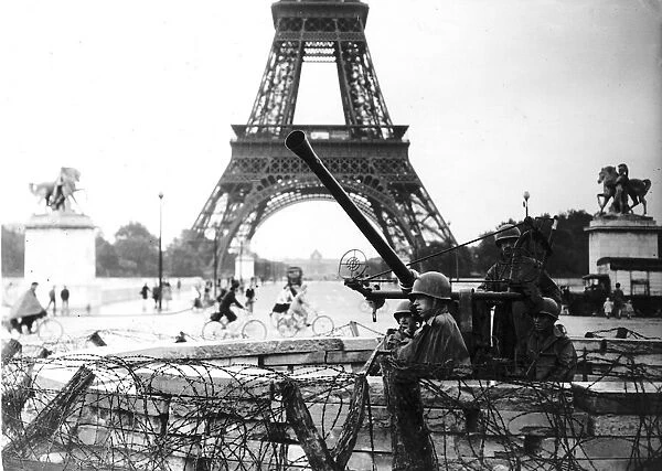An American Army anti aircraft gun beside the Eiffel Tower after the liberation of Paris