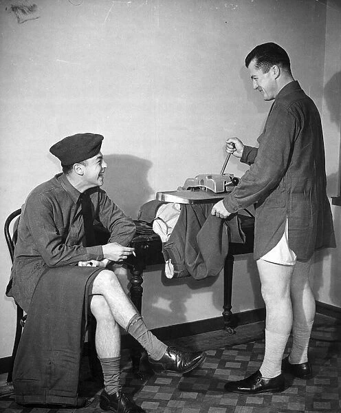 An American army soldier pressing his trousers before going to an American Club in
