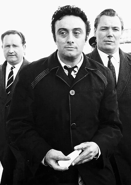 American comedian Lenny Bruce turned away from Heathrow Airport by policeman after