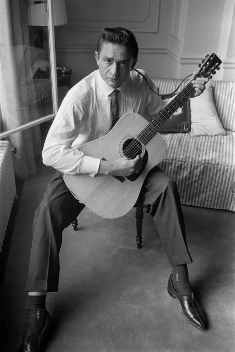 Framed Print : American country singer and musician Johnny Cash poses for photographers at the Savoy