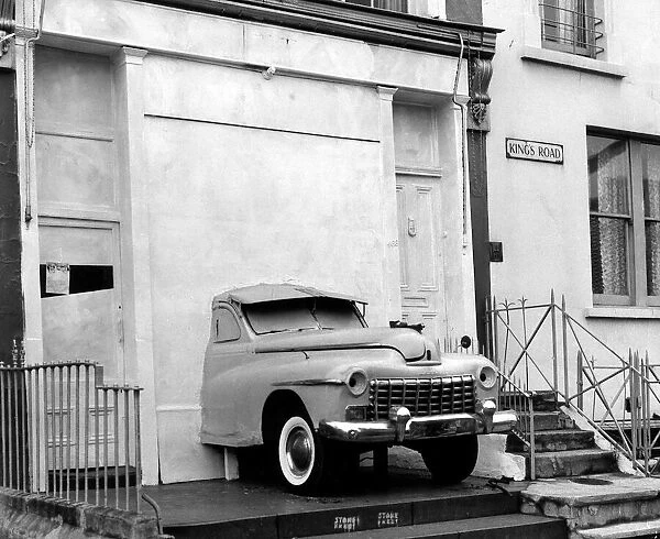 An American Dodge Car fitted into a Shop Window of a boutique called Granny Takes a Trip