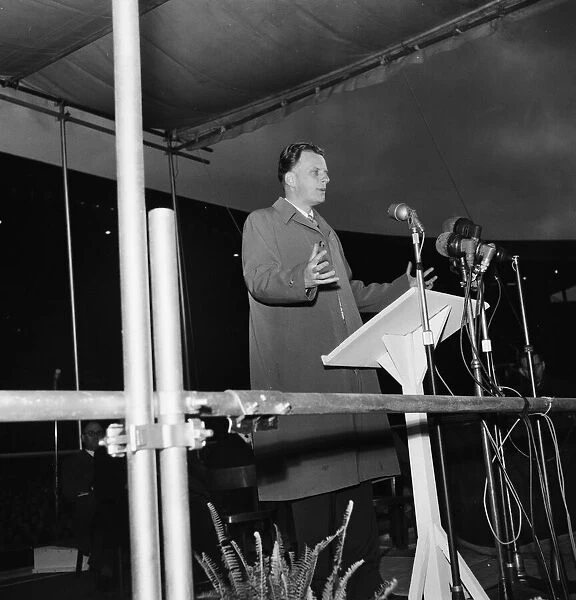 American evangelist Billy Graham addressing the huge crowd at Wembley during his visit to