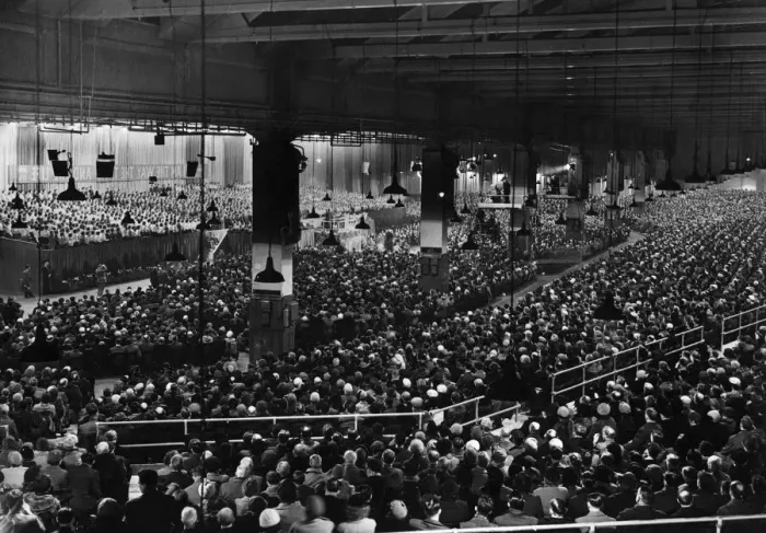 Framed Print : American evangelist Billy Graham addressing a huge crowd of people at Kelvin Hall in