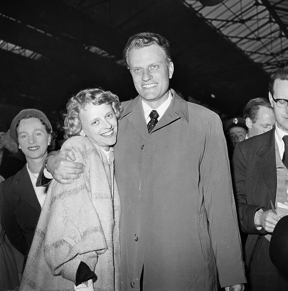 American evangelist Billy Graham arrives at Euston Station in London after his successful