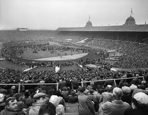 American evangelist Billy Graham speaking at Wembley Stadium during the final meeting of