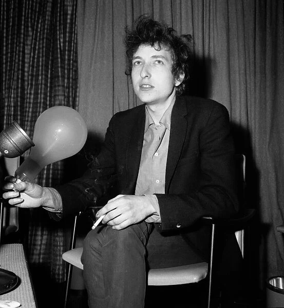 American folk legend Bob Dylan at a press conference after arriving at London airport