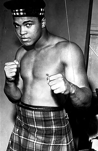 American heavyweight boxer Cassius Clay, dressed in tartan kilt