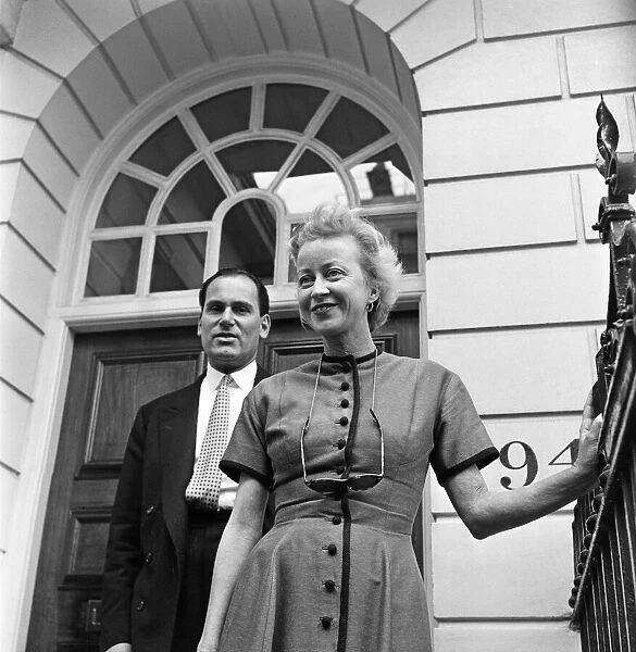 American impresario Anne Deere Wiman outside her home in Westminster with her solicit Mr