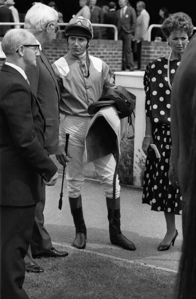 American jockey Steve Cauthen talking in the paddock to owner at Kempton Park, July 1987