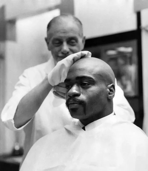 Framed Print : American middleweight boxer Rubin Huricane'Carter having his head shaved Framed Print : American middleweight boxer Rubin Huricane'Carter having his head shaved