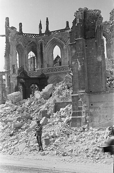 American Military Policeman guards the remains of the church in the remains of