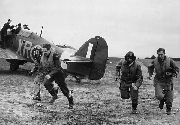 American pilots of No 71 Eagle Squadron rush to their Hurricanes at