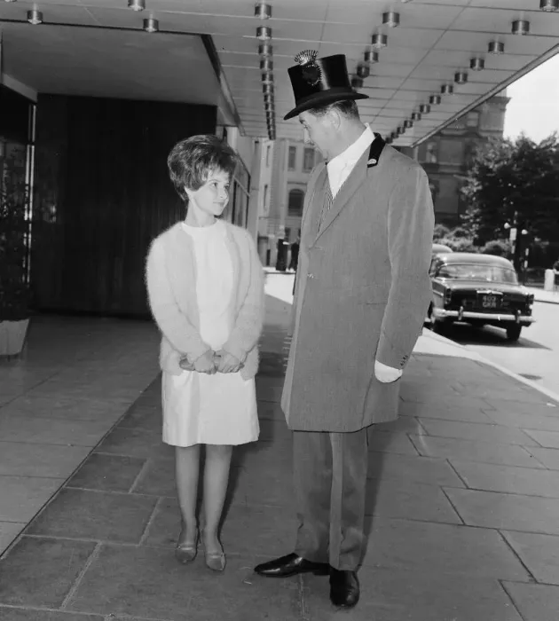 Framed Print : American pop singer Brenda Lee talking to one of the porters outside the Hilton Hotel in Framed Print : American pop singer Brenda Lee talking to one of the porters outside the Hilton Hotel in