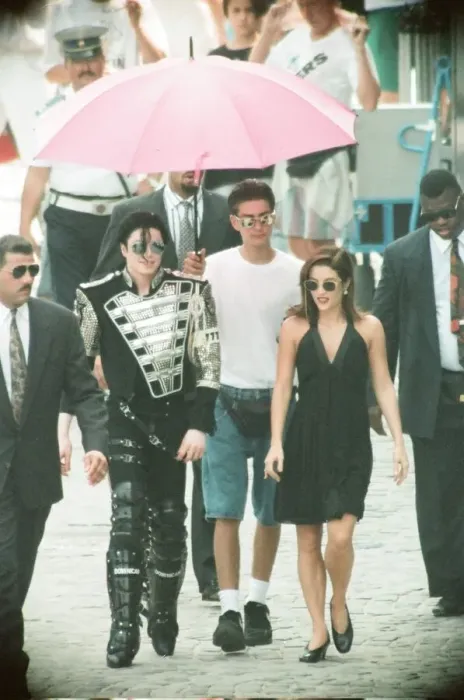 Framed Print : American pop singer Michael jackson with his new bride Lisa-Marie Presley walking