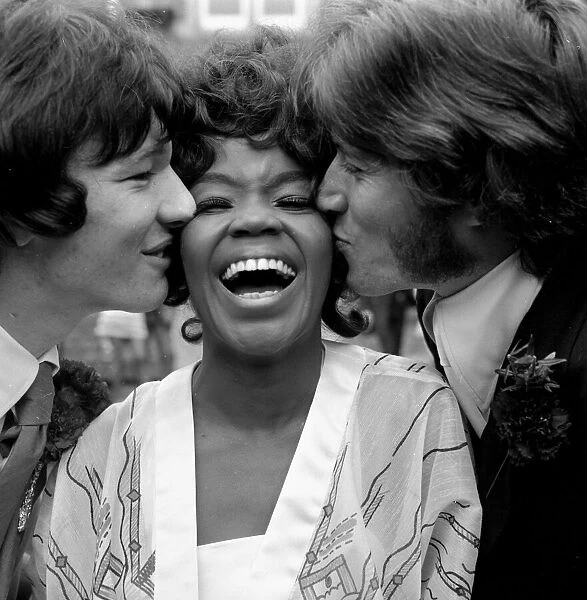 American Pop singer P. P. Arnold receives a kiss from her new husband