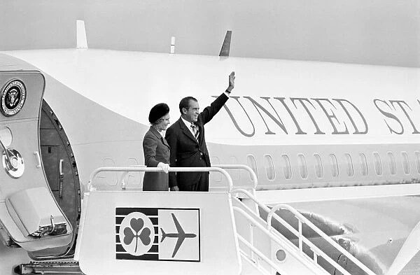 American President Richard Nixon waves to the crowds from Air Force One with his wife Pat