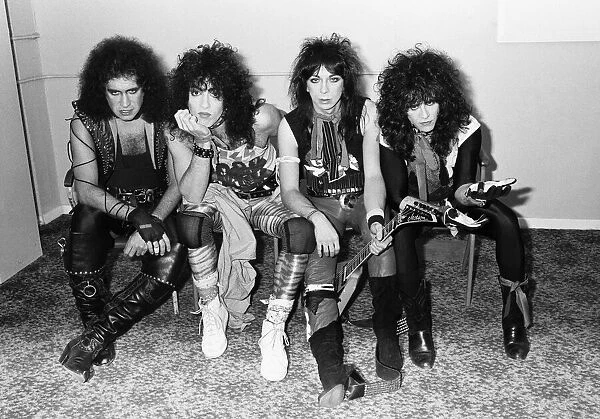 American rock group Kiss seen here in a very quick break between numbers at their concert