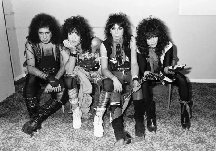 Framed Print : American rock group Kiss seen here in a very quick break between numbers at their concert