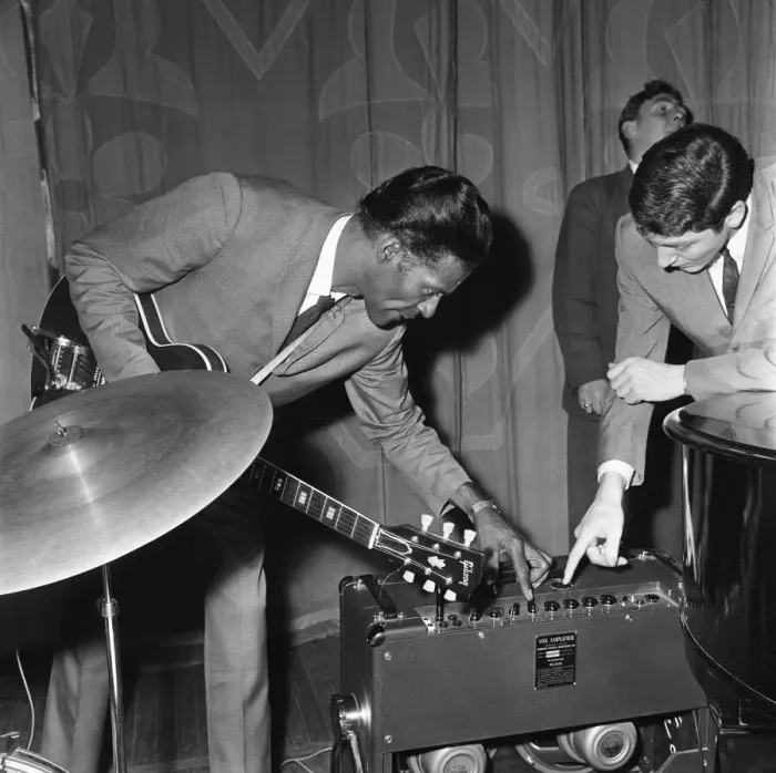 Framed Print : American rock and roll singer and musician Chuck Berry tunes up his guitar before going Framed Print : American rock and roll singer and musician Chuck Berry tunes up his guitar before going