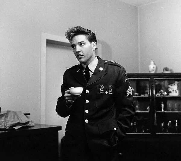 American rock and roll singer and musician Elvis Presley pictured wearing army uniform
