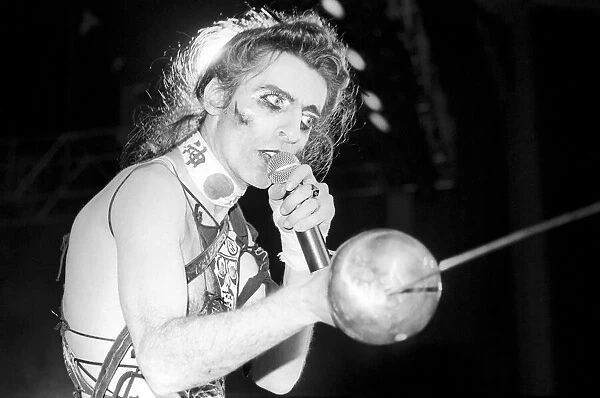 American rock singer Alice Cooper performing in concert at the Hammersmith Odeon during