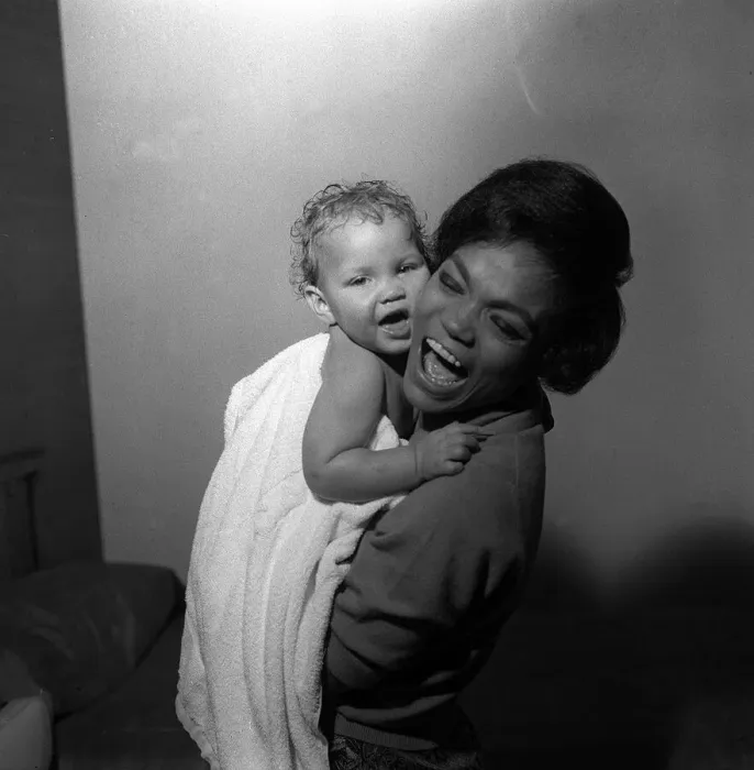 Framed Print : American singer and actress Eartha Kitt, photographed with her baby girl Kitt
