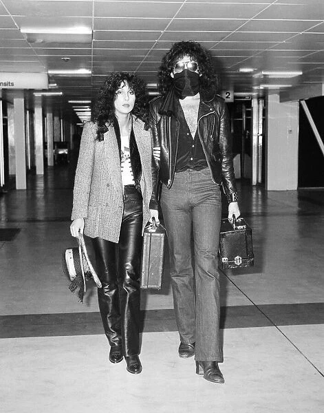 American singer Cher and Gene Simmons, bass guitarist with rock group Kiss, Arrivals