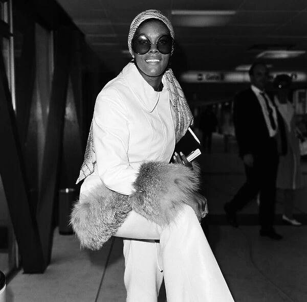 American singer Dionne Warwick at Heathrow Airport. 12th April 1970