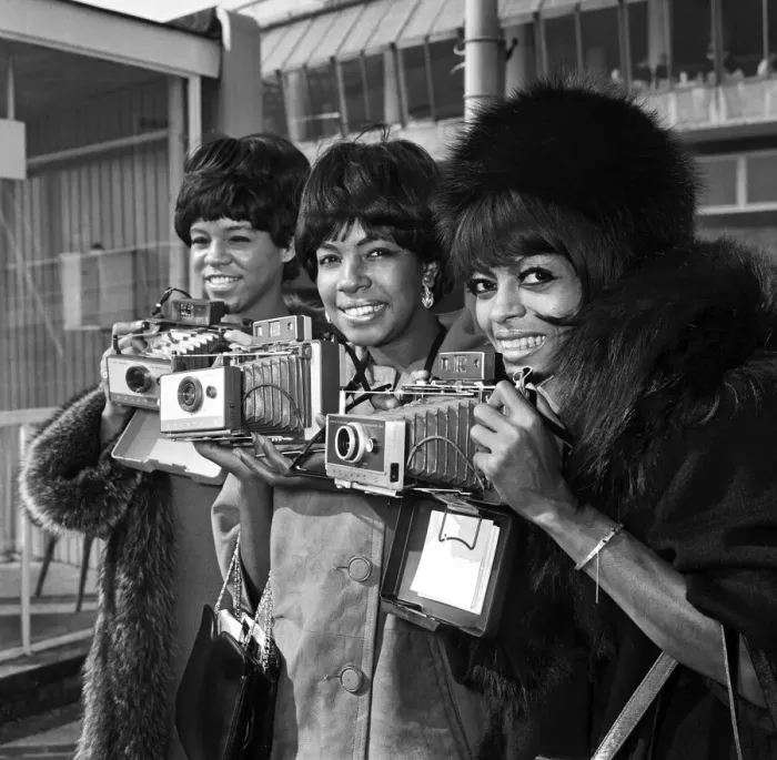 Framed Print : American singing group The Supremes arrive at London airport before taking part in