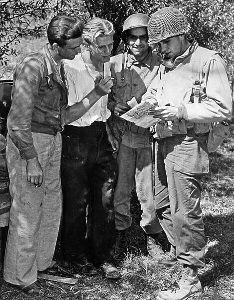 American soldiers liaise with members of the French Resistance during the Allied Invasion